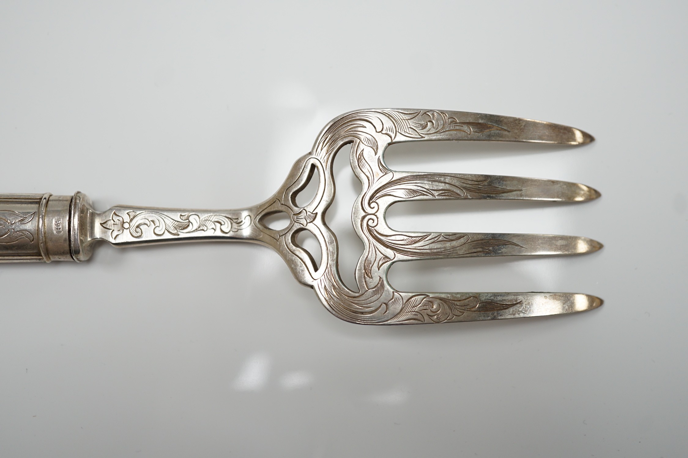 A cased pair of Victorian silver fish servers, by Aaron Hadfield, Sheffield, 1849, with engraved decoration, slice 30.8cm, (loaded handles).